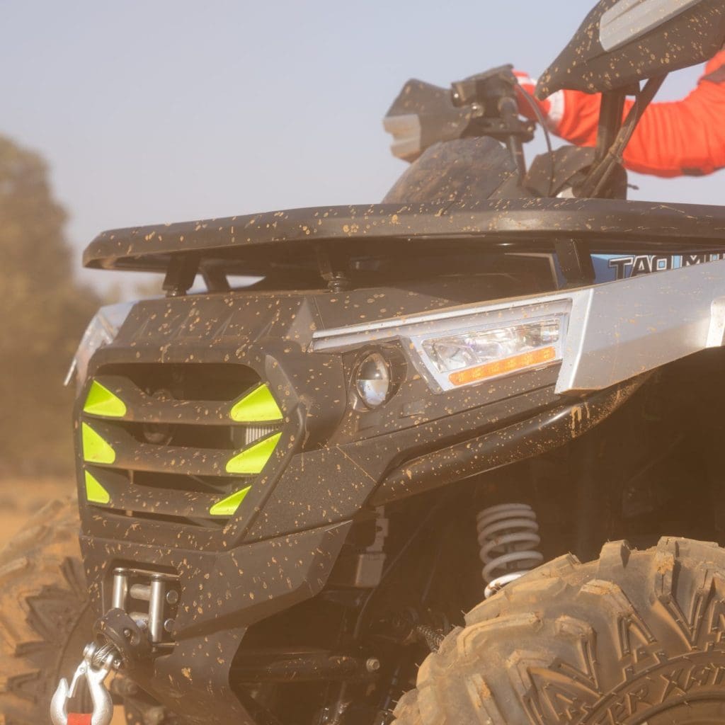 Close-up of the front of a Go-karts Quads & Bikes, quad bike in the dirt